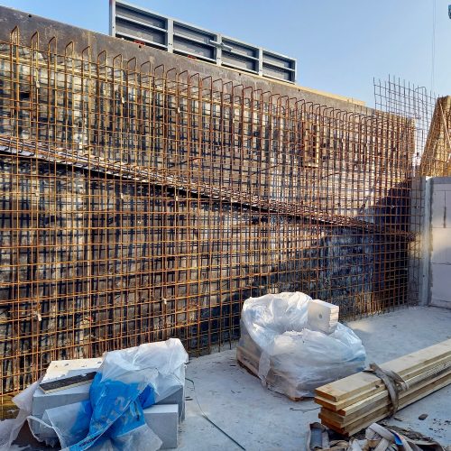 Concrete reinforcement steel shuttering wall in a construction site